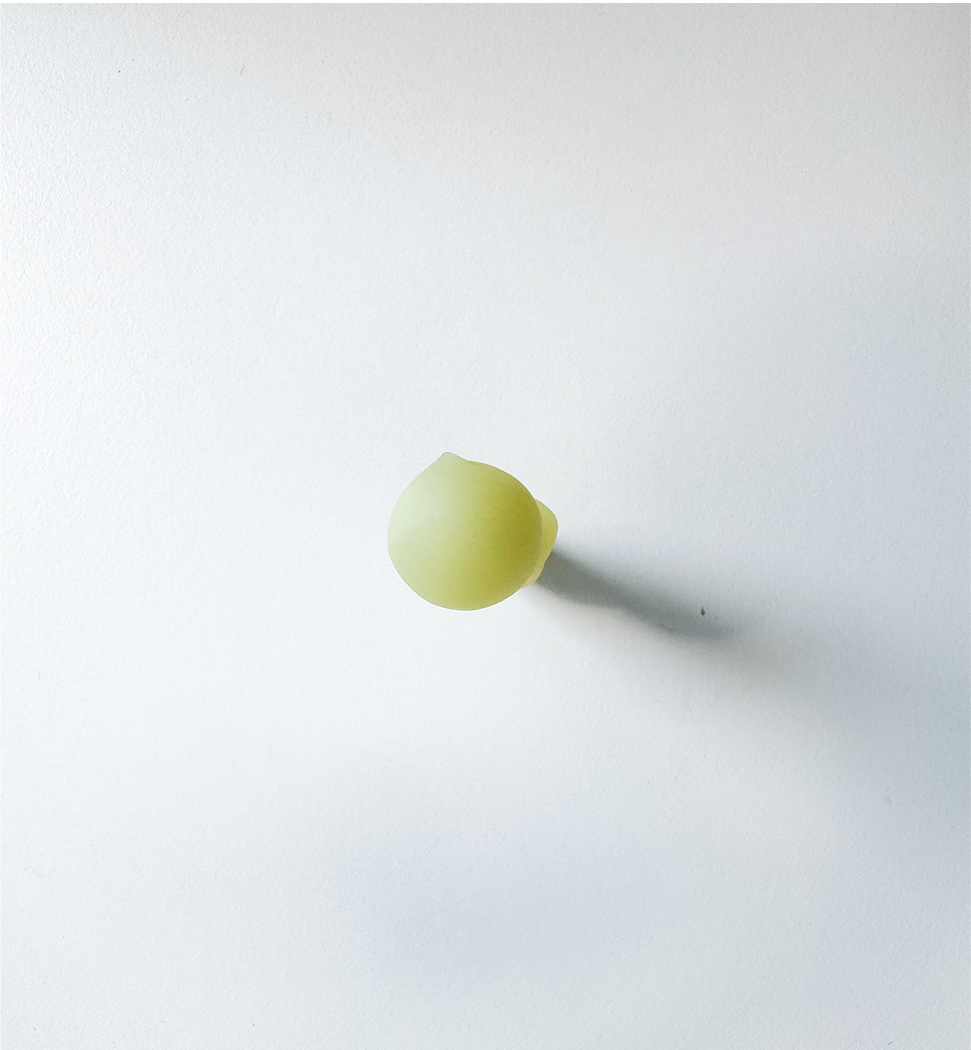 Image of the top view of the Smiski figurine.