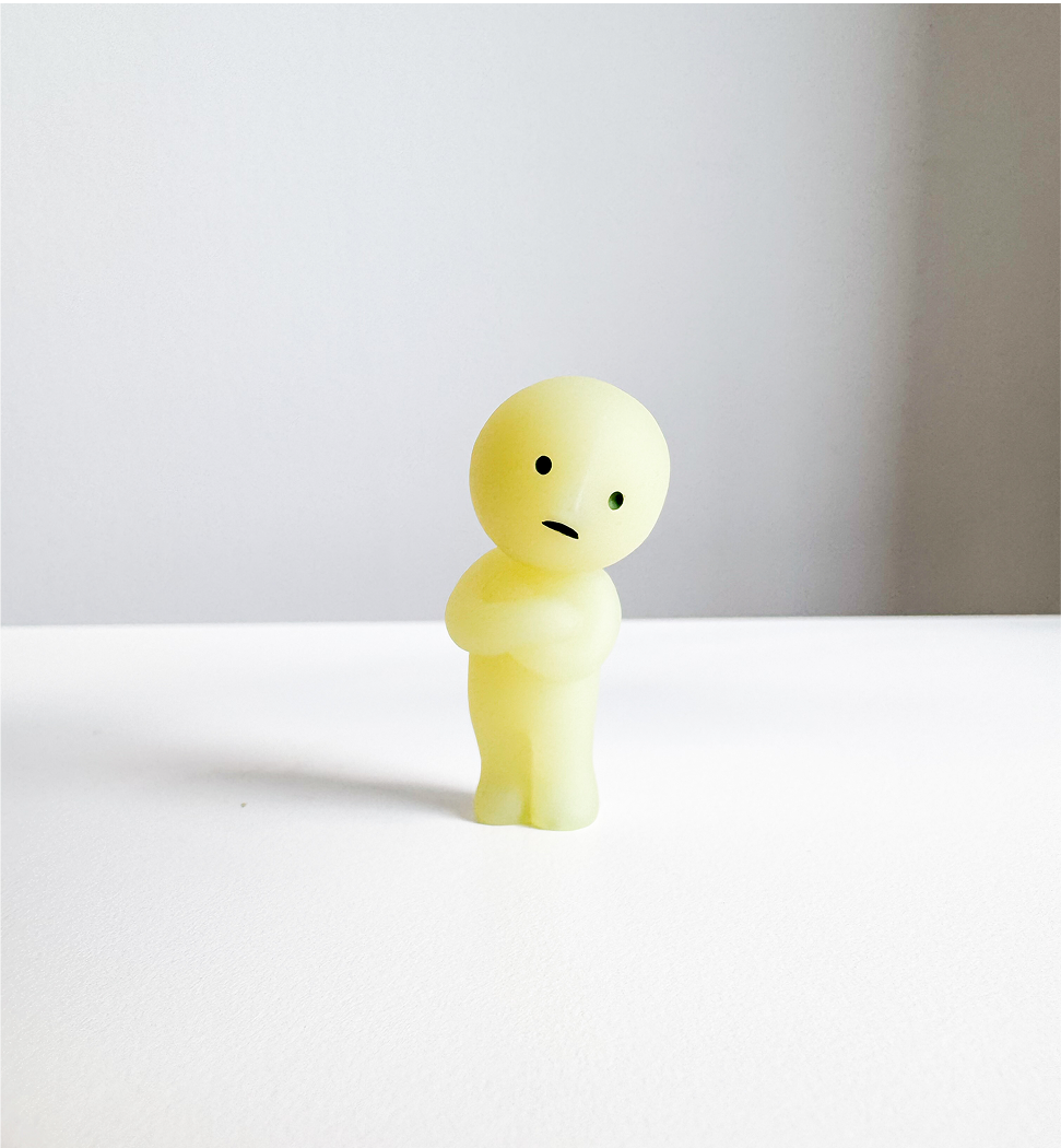 Image of the front view of the smiski figurine.