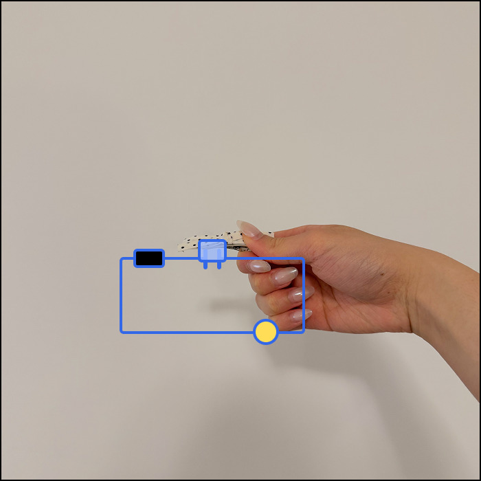This is an example of an clothing based interaction, based on the ribbon's opening motion, the switch is closed when the hinge is inactive.