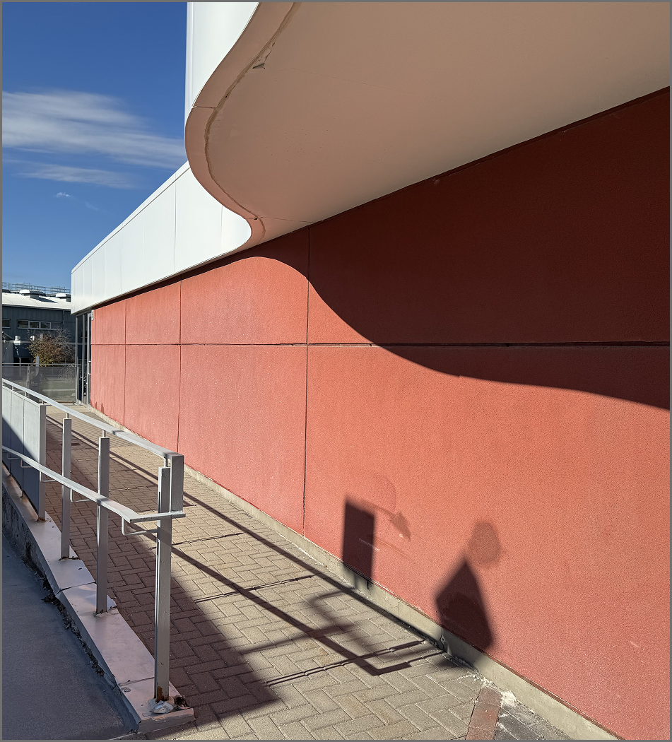 Red wall outside J-wing building